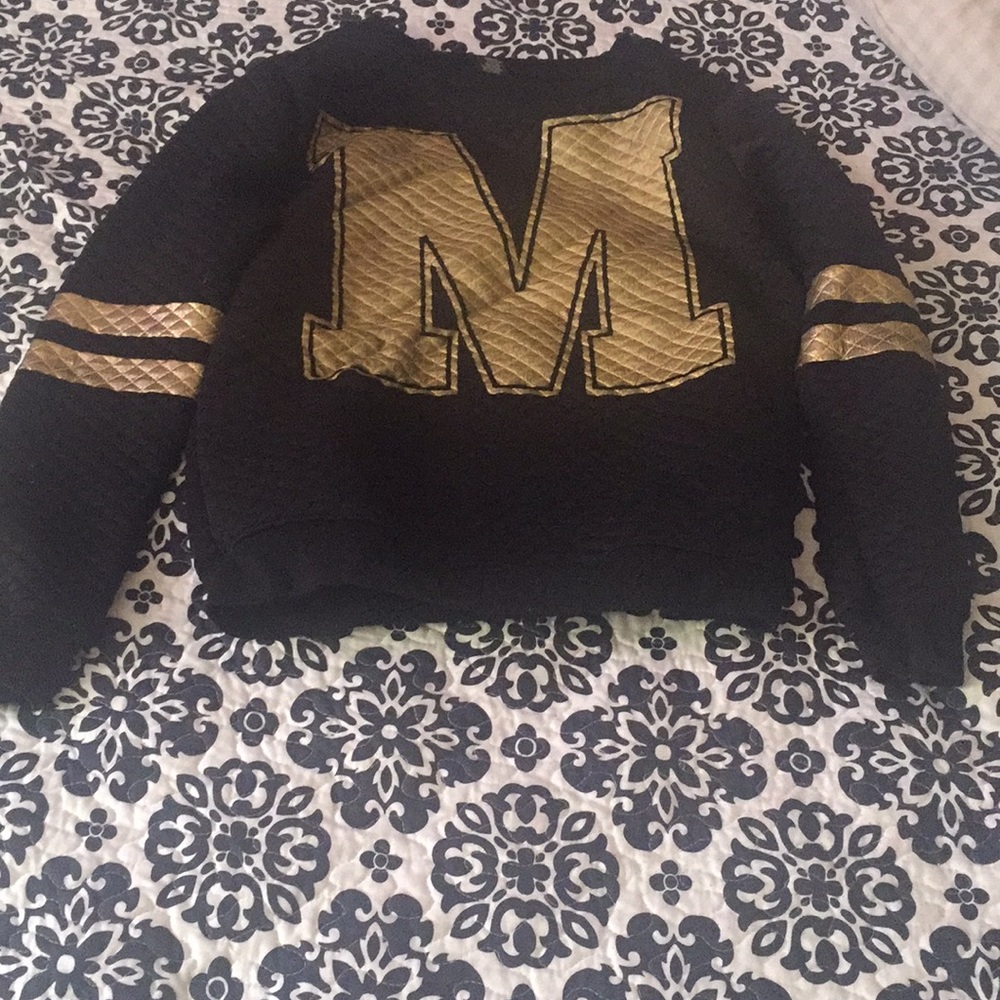 Back and gold sweater